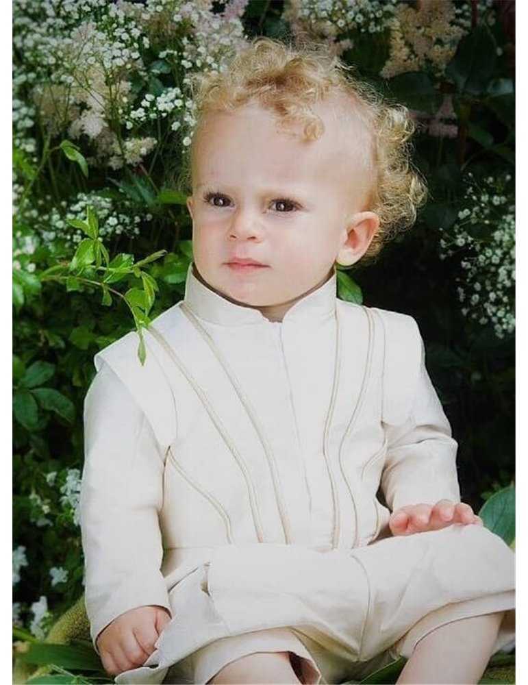 girl in christening bonnet and baptismal dress