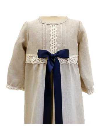 baby in christening gown with luxurious diadem