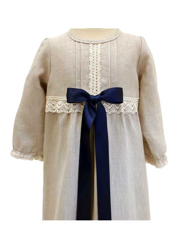 baby in christening gown with luxurious diadem